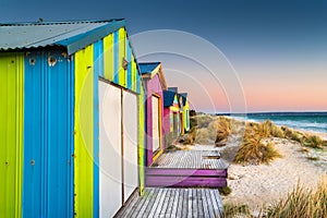 Beach cabins at sunset on Chelsea beach, Victoria, Australia