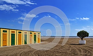 Beach cabins yellow and green