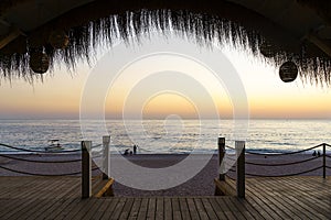 Beach cafe on sea sunset. Beautiful tropical evening on the coast. Relax, summer, vacation.