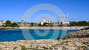 beach of cala\'n bosch, Menorca, Balearic Islands, Spain. blue sea and houses