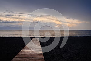 Beach of Calahonda in Costa del Sol, wooden boardwalk leading to Mediterranean Sea photo