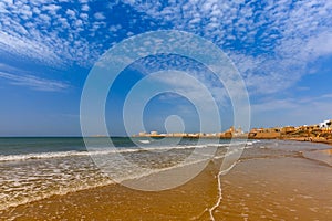 Beach and Cathedral in Cadiz, Andalusia, Spain photo