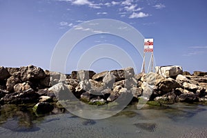 Beach caution sign at winter