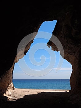 Beach cave with view on the sea