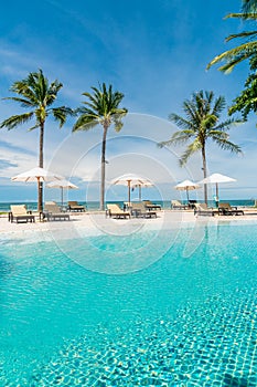 beach chair around swimming pool in hotel resort