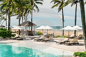 beach chair around swimming pool in hotel resort