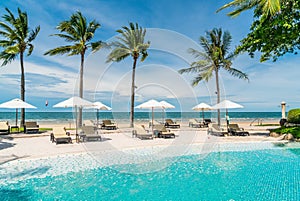 beach chair around swimming pool in hotel resort