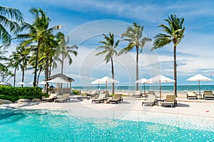 beach chair around swimming pool in hotel resort