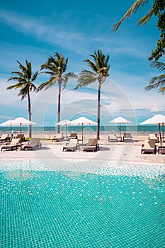 Beach chair around swimming pool in hotel resort