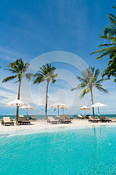 Beach chair around swimming pool in hotel resort