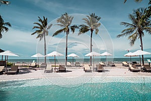 Beach chair around swimming pool in hotel resort
