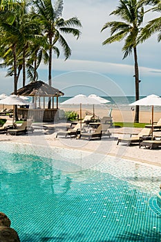 Beach chair around swimming pool in hotel resort