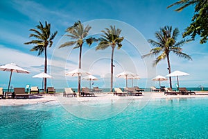 Beach chair around swimming pool in hotel resort