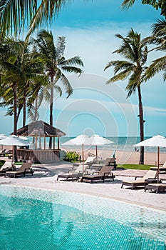 Beach chair around swimming pool in hotel resort
