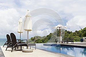 Beach chair in outdoor with swimming pool and sea view andaman s