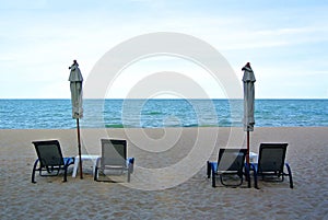 Beach chair and umbrella on idyllic tropical sand beach. Phuket, Thailand