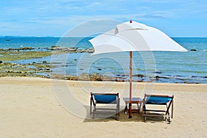 Beach chair and umbrella on idyllic tropical sand beach. Phuket, Thailand