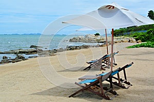Beach chair and umbrella on idyllic tropical sand beach. Phuket, Thailand