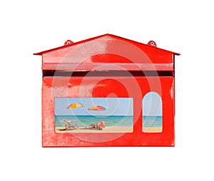 Beach chair and umbrella on sand beach in red mail box on white background,