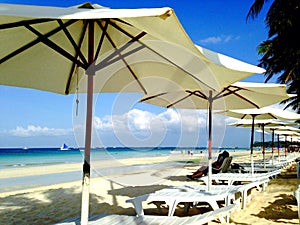 Beach chair and umbrellas