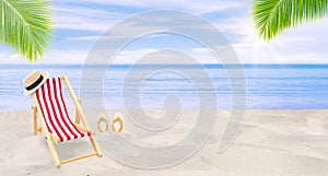 Beach chair, weave hat and white sandal flip flop on sand beach with beautiful seascape view