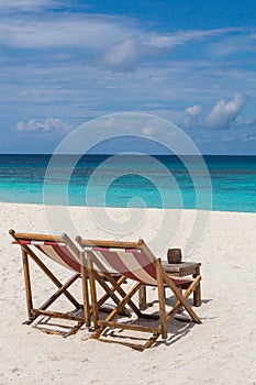Beach chairs on the beach Atoll island Maldives