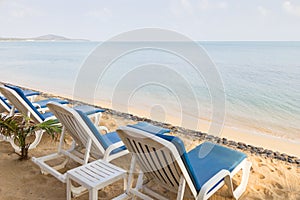 Beach chairs at an empty beach in Thailand