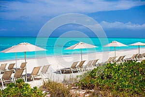 Beach chairs on exotic tropical white sandy beach