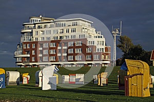 Beach chairs in front of the lakeside terraces