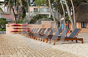 beach chairs on sand beach with tropical vacation at sea