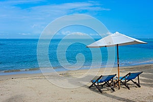 Beach chairs on the sand and blue skys