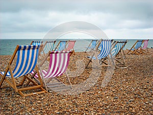 Beach Chairs on the shore at Brighton England