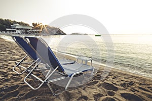 Beach chairs at sunrise