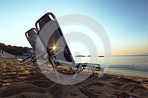 Beach chairs at sunrise