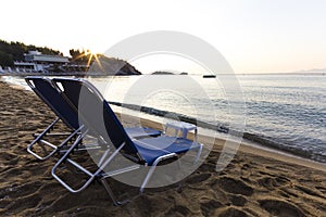 Beach chairs at sunrise