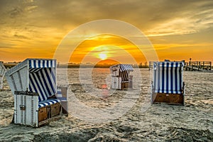 Beach chairs at sunset