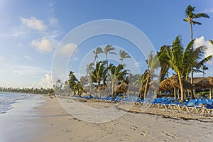 Beach chairs in swimming pool at tropical hotel resort. Relaxing time in the pool