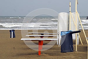 Beach with chairs and trashcans