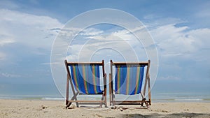 Beach chairs on tropical beach