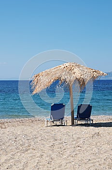 Beach chairs and umbrella