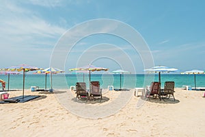 Beach chairs, umbrella on the beach.