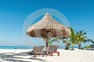 Beach Chairs and Umbrella on island in Phuket, Thailand