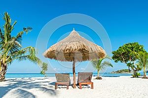 Beach Chairs and Umbrella on island in Phuket, Thailand photo