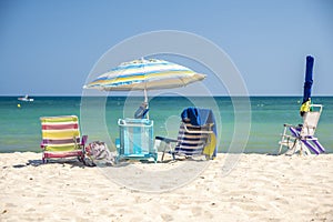 Beach chairs and umbrella, located on a beach in the Mediterranean