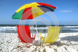 Beach Chairs and Umbrella in Sand