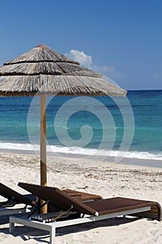 Beach Chairs and Umbrella with Sea View