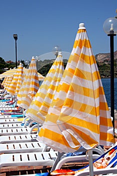 Beach chairs and umbrellas