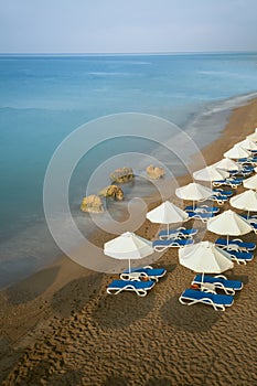 Beach with chairs and umbrellas