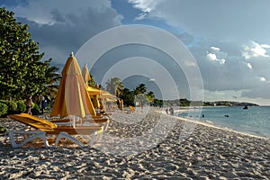 Beach chairs and umbrellas at sunset, Shoal Bay East, Anguilla, British West Indies, BWI, Caribbean