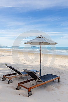 Beach chairs under ambrella on holiday photo